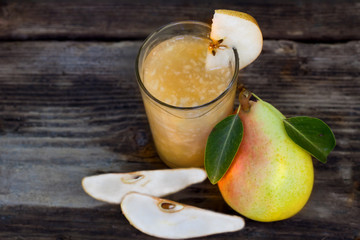 Pear Juice with fresh fruits on vintage background