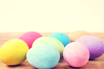 Vintage colorful easter eggs on wood table background