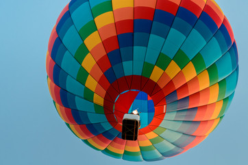 Colored hot air balloon flying in the blue sky