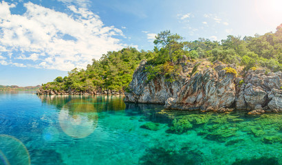 Fototapeta premium panorama of blue lagoon brightly lit with sinlight