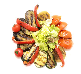 grilled vegetables and greens on a white background