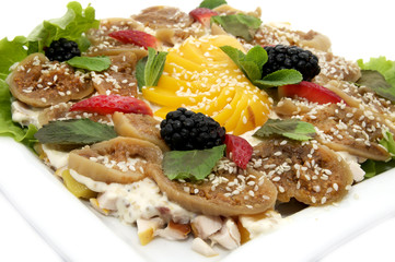 salad with figs on a plate on a white background