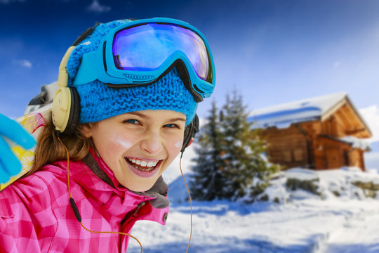 Winter vacation, snow, skier - girl enjoying winter