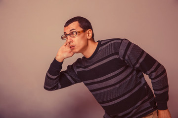 European-looking male of about thirty brunet put his hand to his