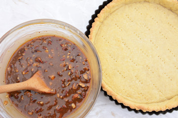 Making pecan pie - nutty pie filling and pie crust