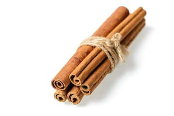 cinnamon sticks on white. (large depth of field, taken with tilt shift lens)