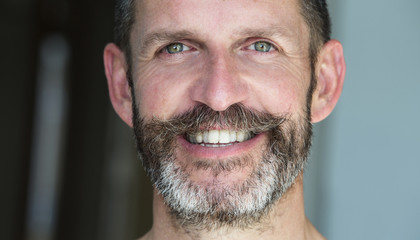 Obraz premium portrait of smiling man with beard