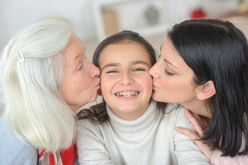 A kiss form mom and grandma