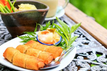 Prawns Spring Rolls with salad and sweet dipping of Thai style.