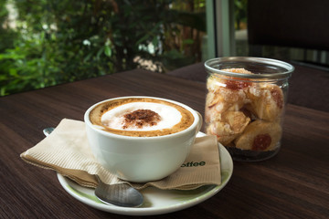 Cup of coffee with cookie for serve
