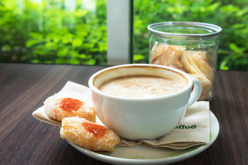 Cup of coffee with cookie for serve