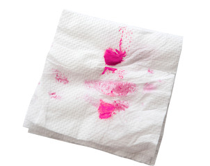 lipstick mark on tissue paper on white (clipping path)