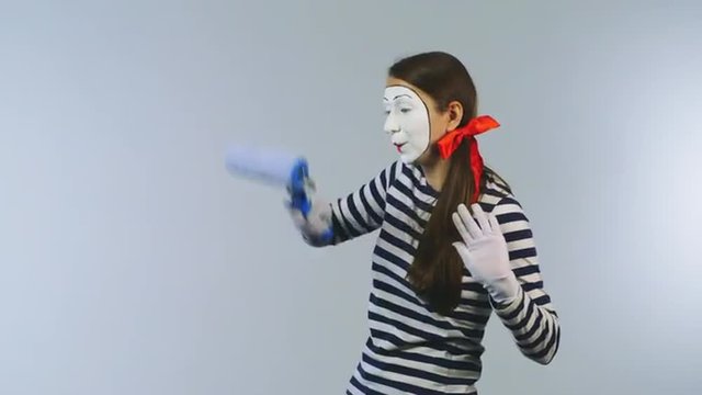 Woman mime invisible wall colors
