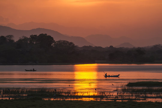 Fisherman in Arugam bay lagoon sunset, Sri Lanka