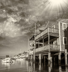 Naklejka premium Wooden Homes over water at sunset