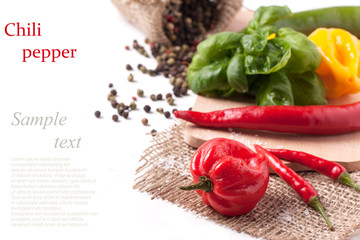 Fototapeta na wymiar Hot chili peppers with basil