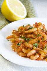 GRILLED HONEY GARLIC SHRIMP AT PLATE ON WOODEN TABLE