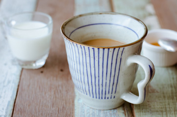 Cup of Espresso Coffee and Milk On Wood Table.