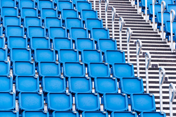Naklejka premium rows of blue seats in a stadium