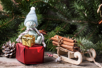 Christmas card with snowman and gifts