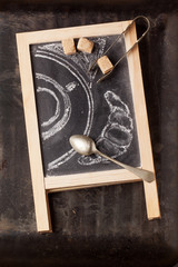 Chalkboard with sugar and painted coffee