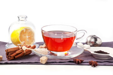 Cup of tea with lemon over white