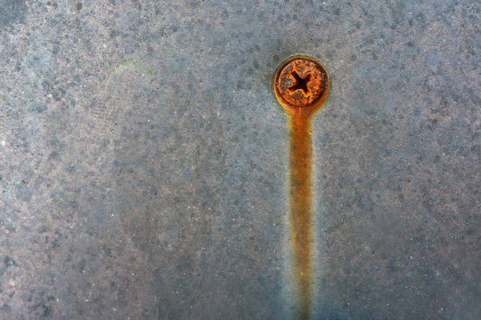 Metal texture with rusty srew