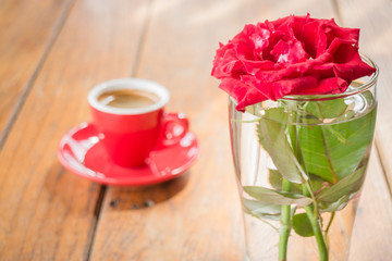 Beautiful table decorated with coffee and red rose