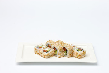 Pieces of sushi on white ceramic plate.