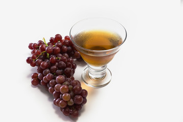 Grapes and juice on white background