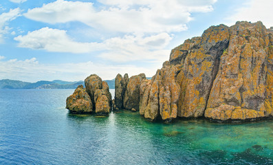 Fototapeta na wymiar small rocky island in sea