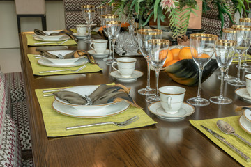 elegant table set in modern style dining room interior