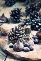 Christmas and New Year composition with fir cones, nuts, chocola