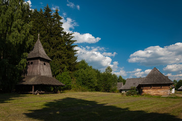 Fototapeta na wymiar Woden belfry from Trstene, Liptov - Museum of the Slovak Village, Martin, Slovakia