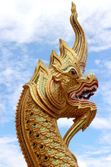 Fototapeta na wymiar Golden snake sculpture in Chiang Mai temple, Thailand.