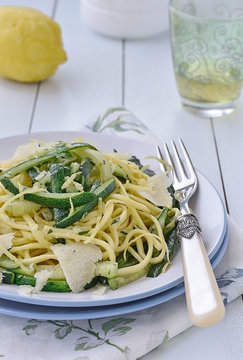 Zucchini Spaghetti alla chitarra with lemon juice and Parmesan cheese. Italian food