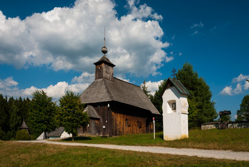 Fototapeta na wymiar Wooden church from Slovenske rudno, Turiec - Museum of the Slovak Village, Martin, Slovakia