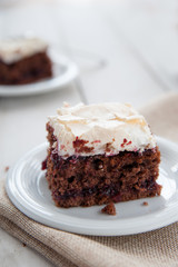 Piece of cherry and meringue cake