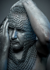 Fantasy, medieval executioner mesh iron rings on the head