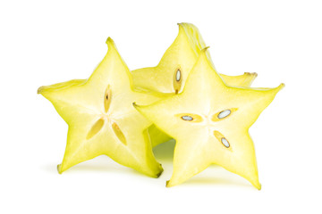 Close-up of three carambola (starfruit) slices, viewed from the front, isolated on white background.