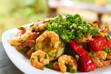 hot appetizer with vegetables and prawns