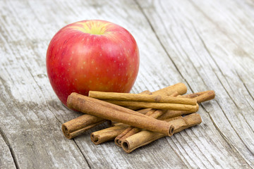 Red apple and cinnamon sticks