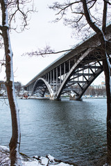 Obraz premium A cold wintry day with the beautiful bridge Västerbron in Stockholm Sweden.