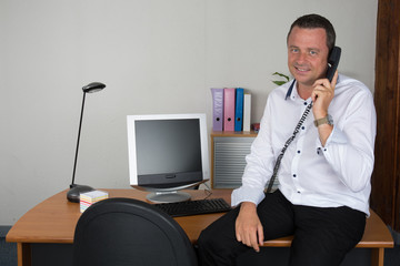 Middle age businessman working on laptop computer