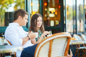 Young romantic couple in Parisian cafe © Ekaterina Pokrovsky