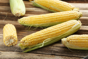 Corns on a brown wooden background