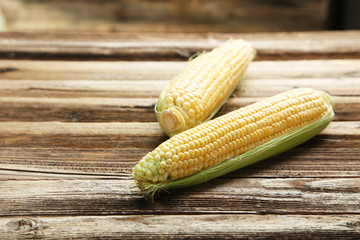 Corns on a brown wooden background