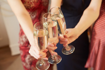 three glasses of champagne close-up women at a party