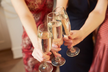 three glasses of champagne close-up women at a party