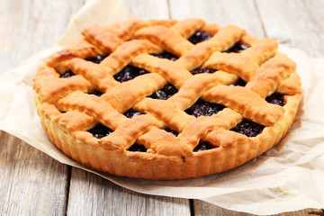Homemade pie on grey wooden background